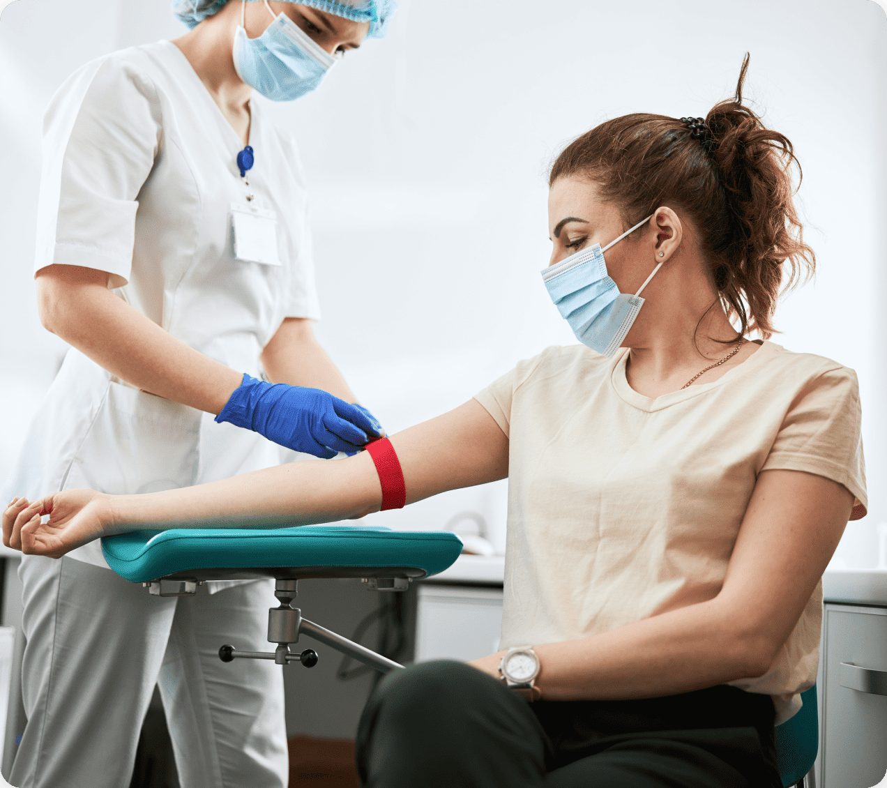 A Bio-Test phlebotomist collecting a blood sample from a patient